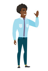 Young caucasian businessman waving his hand.