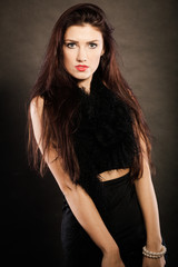 Fototapeta premium woman in sensual black dress on dark