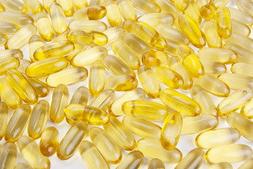 Yellow Vitamin Oil Capsules Macro Closeup Isolated