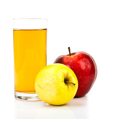 Delicious apple juice in glass and apples isolated on white