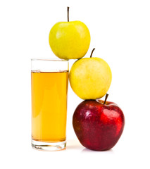 Delicious apple juice in glass and apples isolated on white