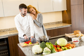 Loving couple in the modern kitchen