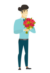 Asian businessman holding a bouquet of flowers