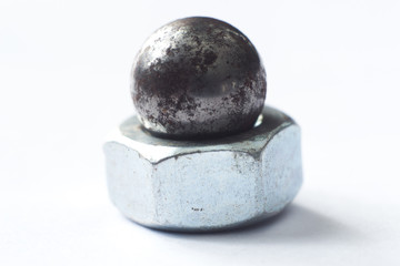 Steel nut on white macro