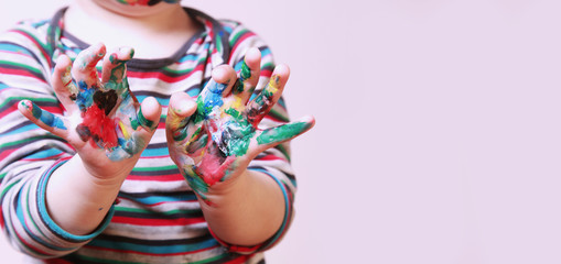 little girl learning to paint (child development in art)