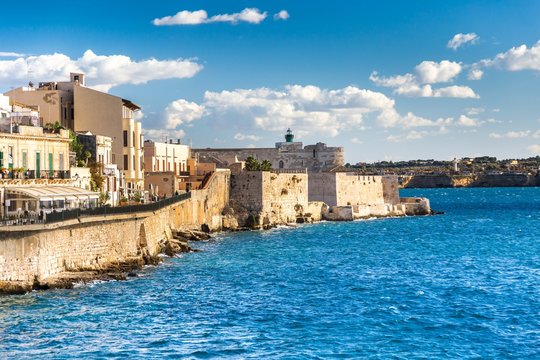 Ionian coast of Ortigia island, a part of Siracusa. Travel photo for a postcard. Sicily, Italy, Europe.