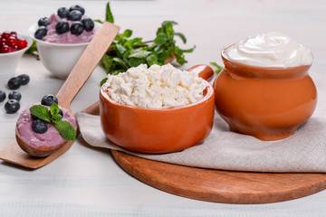 Cottage cheese and sour cream in the decoration on the table