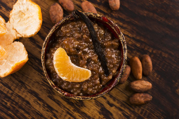 A bowl of chocolate tapioca pudding with fruits
