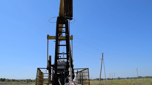 The pumping unit on a well. Equipment of oil wells.