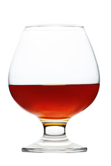 Glass of cognac isolated on white background