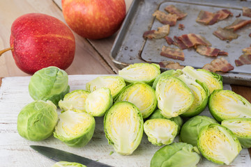 Ingredients for roasted brussels sprouts with bacon and apple.