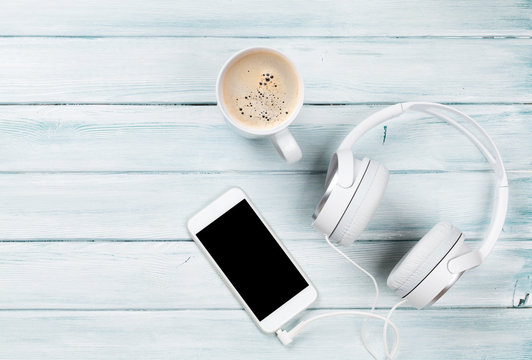 Smartphone, Headphones And Coffee Cup