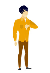 Disappointed asian businessman with thumb down