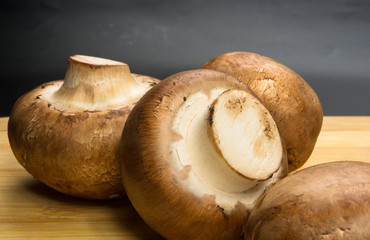 mushroom champignons on a wooden Board