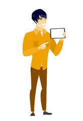 Smiling businessman holding tablet computer.