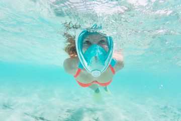 Woman snorkeling underwater in Indian Ocean, Maldives