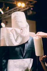 Man wrapped with a paper towel.