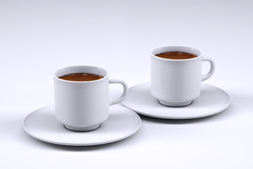 Two white coffee cup isolated on grey background