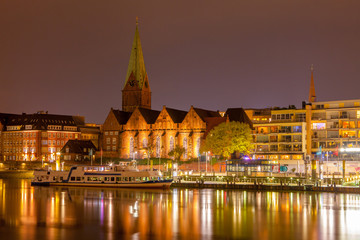 Naklejka na ściany i meble Cityscape of night Bremen, Germany over the Rhein river