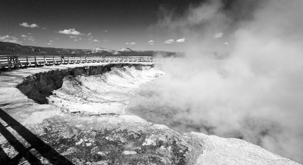 Excelsior Geyser in the Midway Geyser Basin next to the Firehole River in Yellowstone National Park in Wyoming USA - black and white