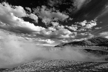 Excelsior Geyser in the Midway Geyser Basin next to the Firehole River in Yellowstone National Park in Wyoming USA - black and white