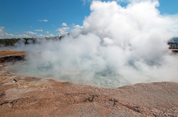 Excelsior Geyser in the Midway Geyser Basin next to the Firehole River in Yellowstone National Park in Wyoming United States