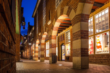 Boettcherstreet by night in Bremen. Only about 100 m long, it is famous for its unusual architecture and ranks among the citys main cultural landmarks.