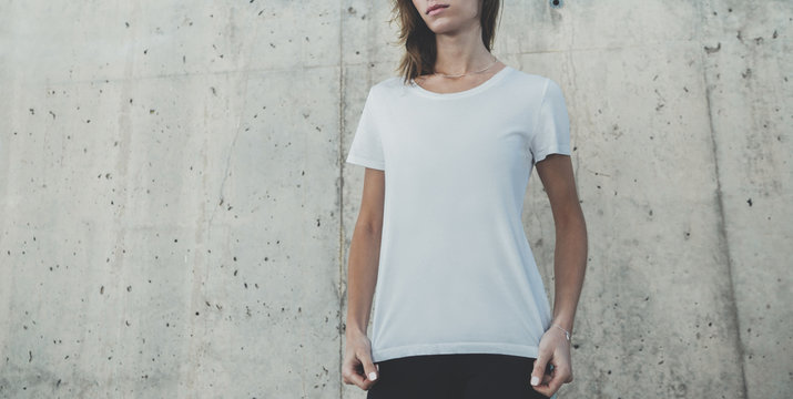 Mock-up of blank white t-shirt, young hipster girl wearing template white t-shirt with empty space for your logo or design