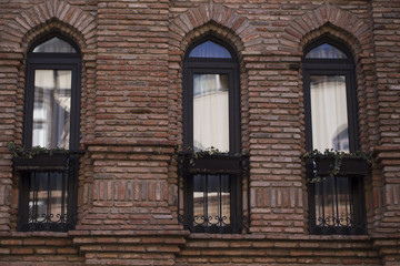 Facade with three narrow windows of the building.