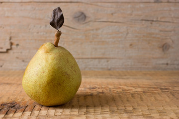 Pear fruit on wooden background