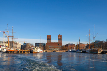 OSLO, NORWAY, 28 FEB 2016: View of City hall, boats and harbour from water