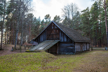 View of the rustic farm two-storey barn. Wooden architecture of North and Baltics