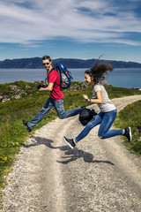 Two young people having fun on the countryside road, Norway