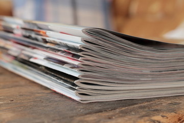 Magazines on the wooden table 