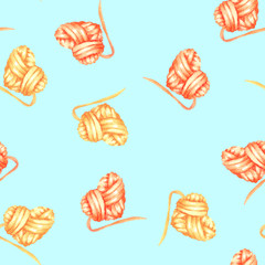 Seamless pattern with watercolor yellow and red heart ball of yarn; hand drawn on a blue background