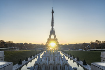 Landscape view of a warm sunrise over Paris and in the middle of the Eiffel tower
