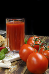 Raw Organic red Tomato Juice with salt, basil and bread