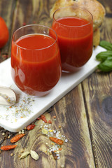 Raw Organic red Tomato Juice with salt, basil and bread