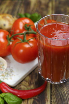 Raw Organic red Tomato Juice with salt, basil and bread