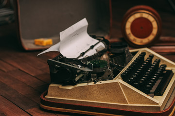retro typewriter and sheets of paper