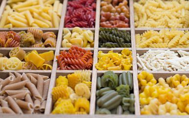 Variety of types, colors and shapes of Italian pasta. Dry pasta