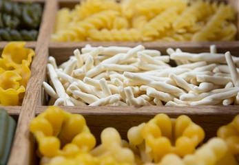 Variety of types, colors and shapes of Italian pasta. Dry pasta