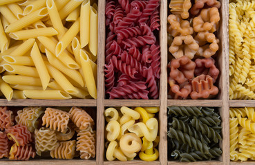 Variety of types, colors and shapes of Italian pasta. Dry pasta
