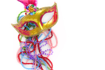 Mardi gras mask and beads on white background.Top view. © vetre