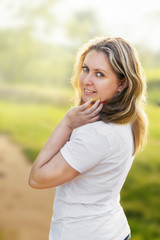 Happy lifestyle portrait of a beautiful young model girl with a sweet smile