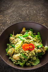 Pearl barley, green beans, tomato salad on ceramic plate