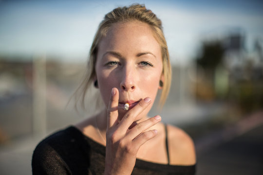 Blonde woman smoking