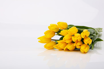 Postcard - a bouquet of yellow tulips. Holidays: Valentine's Day, 8 March, Easter.