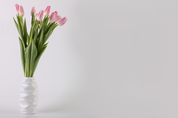 Postcard - a bouquet of pink tulips in a vase. Holidays: Valentine's Day, 8 March, Easter.