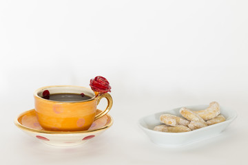 Beautiful handmade orange cup with red rose